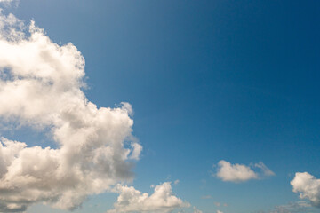 .The sky was a brilliant blue, dotted with white clouds that moved gracefully across the...