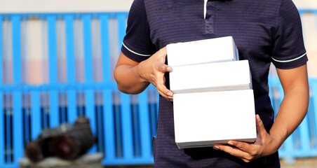 Close-up of a parcel delivery man for business transport