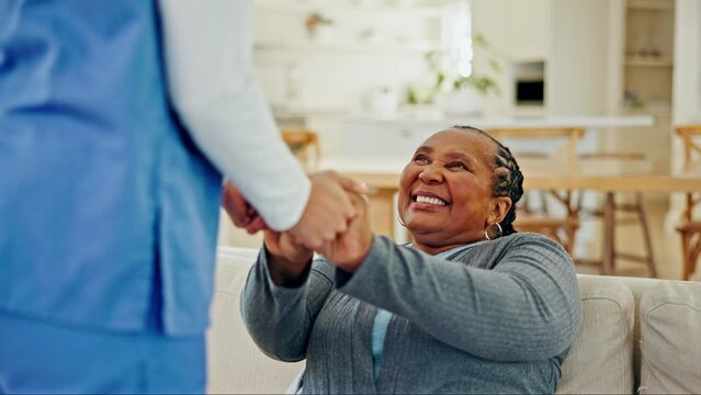 Old woman, African and holding hands with nurse and trust, support and conversation with kindness and elderly care. Help, caregiver and patient, homecare and communication with comfort and respect