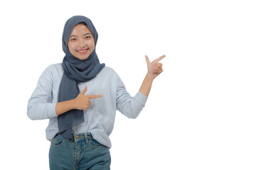 Young Asian Hijab Woman with Pointing to Copy Space