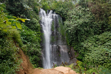 Bali's Waterfall in Long Shutter Grace, Brown Ground and Lush Greenery