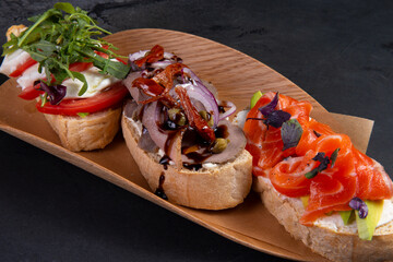 Assorted bruschettas on a plate.