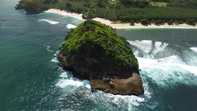 The waves are big at Tanjung Penyu Mas Beach and the view of the beach is very beautiful