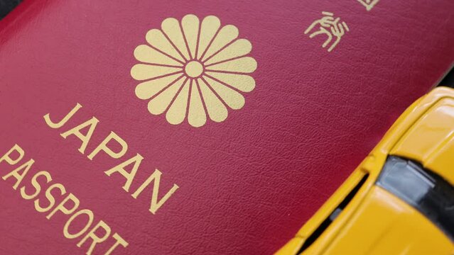 Image photo of Japanese passport and car.