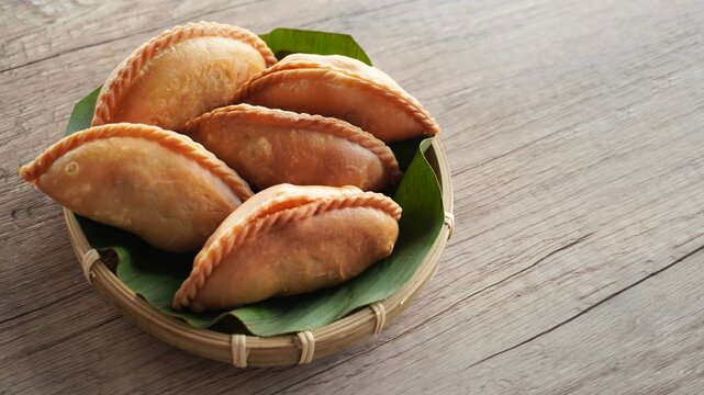 Close up image of Malaysian traditional snack karipap or curry puff.