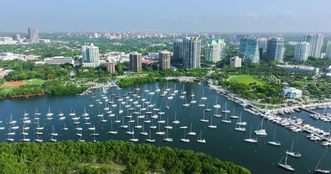 Aerial view of Dinner Key marina with luxury sailboats and yachts in Coconut Grove upscale neighborhood of Miami city in Florida, USA