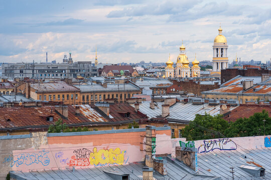 view of the rooftops in the historical center of St. Petersburg during the rain