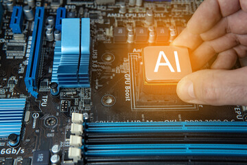 Close up of a hand holding an Ai chip on a electronic circuit board, artificial intelligence concept and new technologies