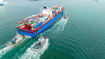 Cargo container ship carrying container and running with tug boat for import goods to cargo yard...