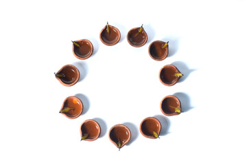 TOP VIEW DIWALI PRADIP WITH DECORATIVE CIRCLE .ISOLATED ON WHITE BACKGROUND.