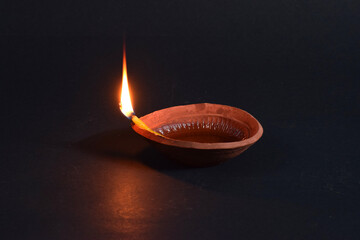 DIWALI PRADIP WITH ISOLATED BLACK BACKGROUND.TOP VIEW WITH SELECTIVE FOCUS.