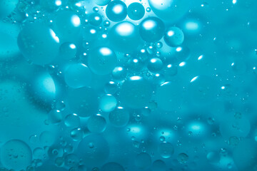 Oil drop background on blue water surface It is natural and abstract.