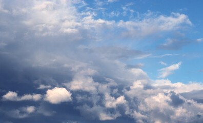 Fototapeta premium Sky landscape. Mesmerizing clouds on the background of sunset.