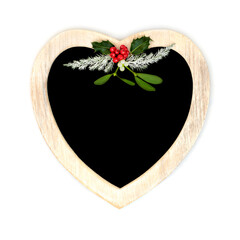 Christmas heart shape wreath with holly, mistletoe and fir. Traditional romantic symbol for festive...