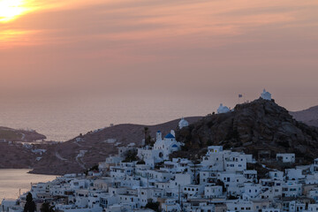 Panoramic view of the beautiful village also known as chora, in Ios Greece, while the sun is setting