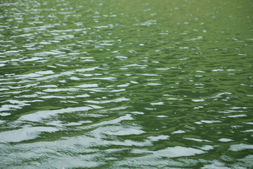 Destination of Beautiful Silhouette and twilight of sunset Reflected light on the river surface and glittering waves in the River. water background