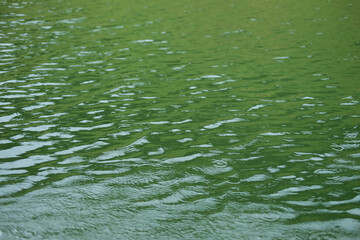 Destination of Beautiful Silhouette and twilight of sunset Reflected light on the river surface and glittering waves in the River. water background