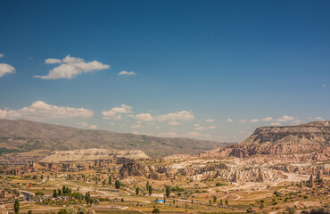 Rocky landscape in Cappadocia, Turkey. Travel in Cappadocia. Unusual semi-desert mountain ranges. Amazing Rocky summer landscape in Cappadocia Goreme