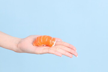 Hand with Sushi