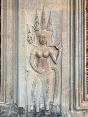 The famous bas-relief of Apsaras, celestial maidens, with intricate hairstyles on the inside wall of the first floor of the Angkor Wat temple in Siem Reap, Cambodia.