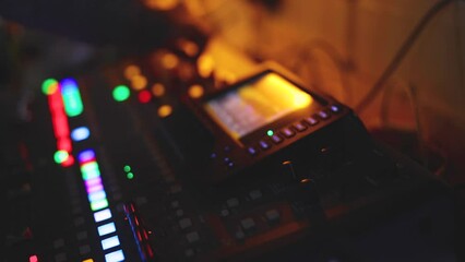 View of lighting technician operator working on mixing console workplace during live conference event, concert show broadcast, light mixer controller panel, workplace sound professional equipment
