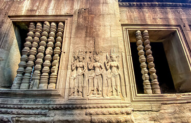 The famous bas-relief of Apsaras, celestial maidens, with intricate hairstyles on the inside wall of the first floor of the Angkor Wat temple in Siem Reap, Cambodia.
