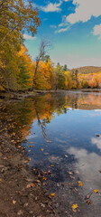 Fototapeta na wymiar Autumn landscapes near a lake in Canada in the province of Quebec