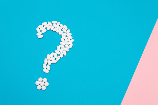 Question Mark Made from White Pills and Tablets, Lying on Blue Background. Global Pharmaceutical Industry and Medicinal Products