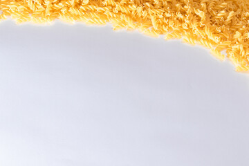 Uncooked Fusilli Pasta with Copy Space on White Background. Raw and Dry Macaroni. Fat and Unhealthy...