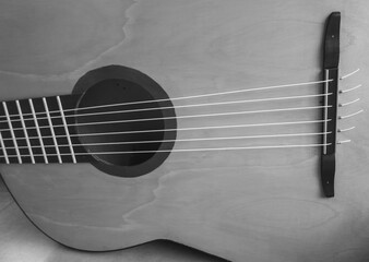Monochrome macro of a 6-string guitar