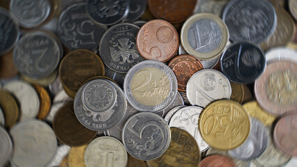 2 Euro. Coins from different countries of the world. Polish Zloty, Czech Crowns, Euro, Russian Ruble