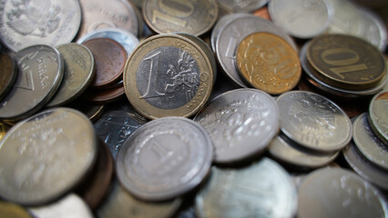 1 Euro. Coins from different countries of the world. Polish Zloty, Czech Crowns, Euro, Russian Ruble
