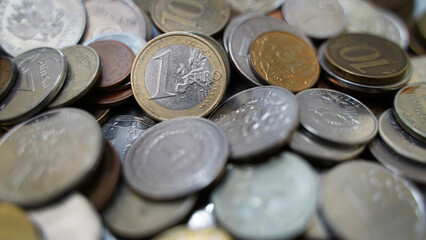 1 Euro. Coins from different countries of the world. Polish Zloty, Czech Crowns, Euro, Russian Ruble