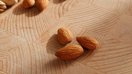 Nuts, almonds on wooden background