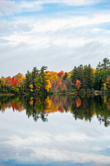 Colorful autumn trees on lake of the Falls in Mercer, Wisconsin