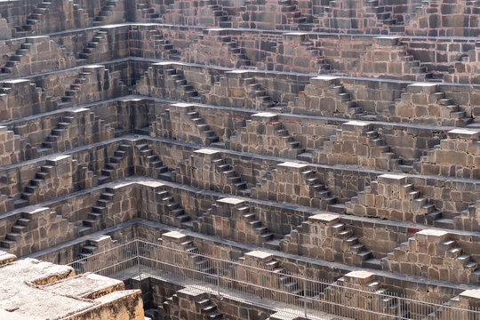 View of Chand Baori stepwell situated in the village of Abhaneri in the Indian state of Rajasthan. It is one of the deepest and largest stepwells in India