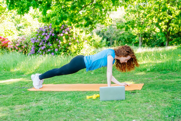 The happy person doing yoga and exercise in nature for mental health, wellness, and fitness