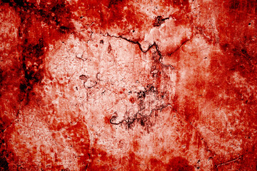 Red wall scratches which can be used as a horror background. Old shabby blood paint and plaster cracks