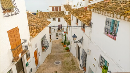 Partial view of Altea, Valencian Community.
Traditional street of the city whitewashed and sloping towards the sea