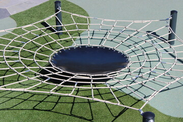 A spiderweb trampoline is a draw to youth and parents alike.