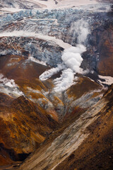 Beautiful mountain landscape, crater of active volcano: fumarole and hot spring, geothermal gas-steam activity, lava plain. Amazing volcanic landscape,