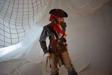 A reckless pirate in a cocked hat, a guy in a pirate costume, a sea robber, a portrait on a...