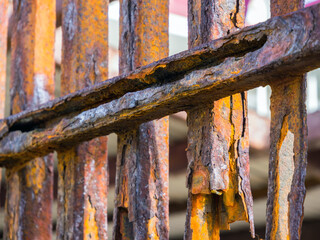 Metal fence destroyed by corrosion near sea water