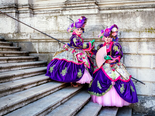 Fototapeta na wymiar Carneval Costumes,Santa Maria de la Salute steps.Veneto,Venice,Italy,Europe