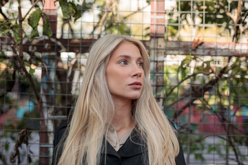 portrait of a wonderful young blond woman at autum in berlin