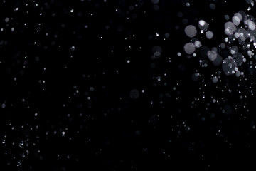 small drops of rain, snow on a black background. wind. Natural background - obrazy, fototapety, plakaty