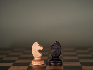 business strategy brainstorming chess board game with manual touch of black background with free...