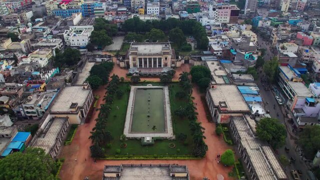 Aftab Mahal at Chowmahalla Palace aerial view with crowded buildings around in old city, hyderabad, telangana