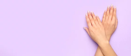 Rolgordijnen Female hands with beautiful manicure on lilac background with space for text © Pixel-Shot