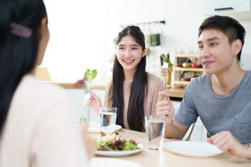 Happy Asian man and women enjoy having a launch together. Group of Asian people have a launch.